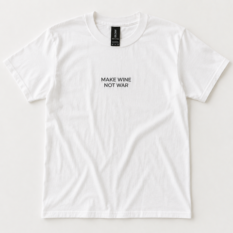 A white short-sleeve crewneck t-shirt with the text 'MAKE WINE NOT WAR' printed in black sans-serif font on the center chest. The shirt is laid flat against a light off-white background, showing a black neck label with the brand 'GILDAN' visible.