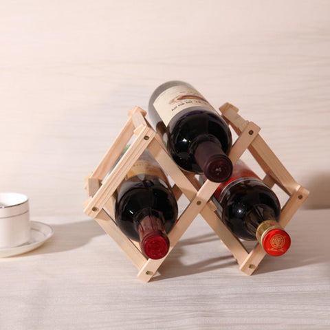 https://wineislife-store.com/cdn/shop/products/folding-bottle-holder-wine-is-life_large.jpg?v=1588189173